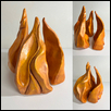 ETERNAL FLAME -- Artist: Lisa Healey Size: 12" x 26" x 14" Medium: Ceramic Price: $600.00